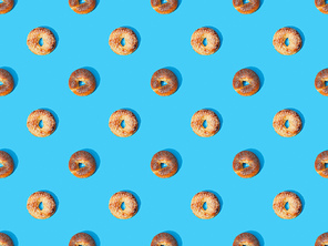 top view of fresh buns on blue background, seamless pattern