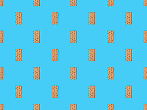 top view of fresh crispbread on blue colorful background, seamless pattern