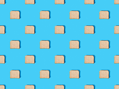 top view of fresh toast bread on blue colorful background, seamless pattern