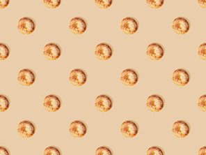top view of fresh buns on beige background, seamless pattern