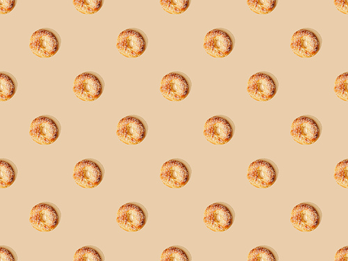 top view of fresh buns on beige background, seamless pattern