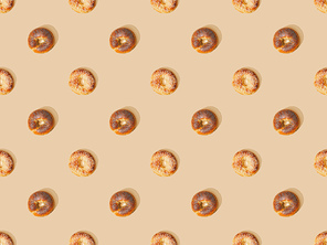 top view of fresh buns on beige background, seamless pattern