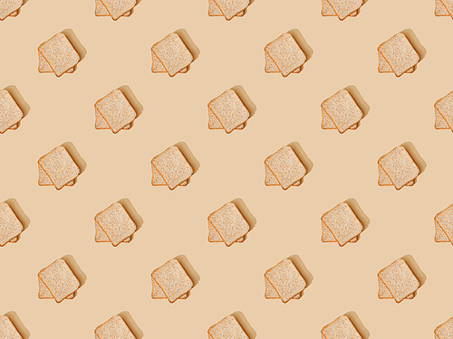 top view of fresh toast bread on beige background, seamless pattern