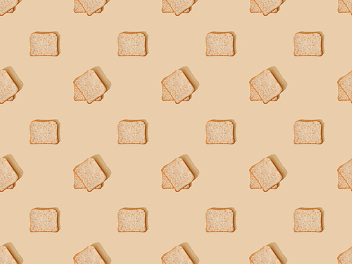 top view of fresh toast bread on beige background, seamless pattern