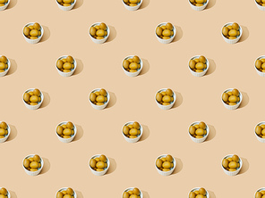 olives in bowls on beige background, seamless pattern