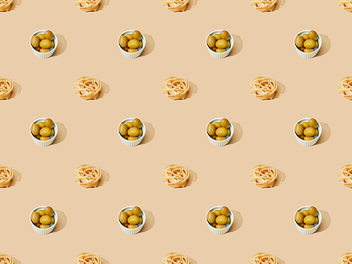 fresh pasta with olives on beige background, seamless pattern