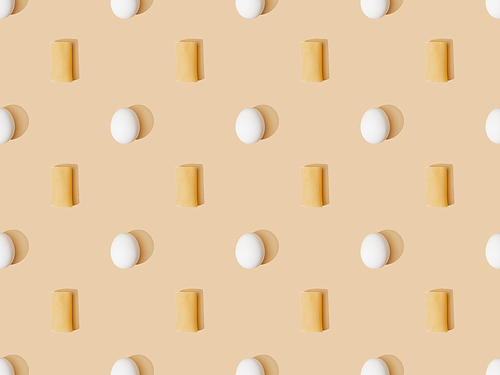 top view of fresh cannelloni with eggs on beige background, seamless pattern