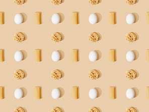 top view of fresh pasta with eggs on beige background, seamless pattern