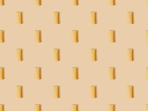 top view of fresh cannelloni on beige background, seamless pattern