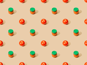 fresh tomatoes and puree in glass jar on beige background, seamless pattern