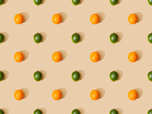 top view of ripe oranges and limes on beige background, seamless pattern