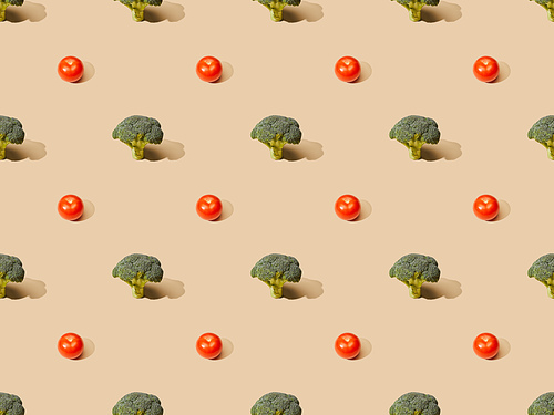 fresh green broccoli and tomatoes on beige background, seamless pattern