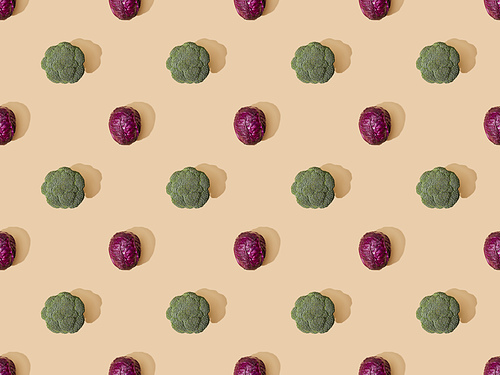 top view of whole ripe red cabbage and broccoli on beige background, seamless pattern
