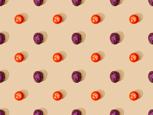 top view of whole ripe red cabbage and tomatoes on beige background, seamless pattern