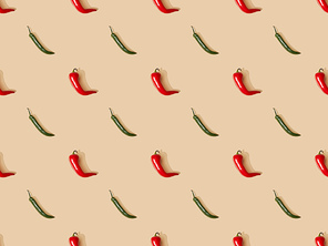 top view of red spicy chili peppers and jalapenos on beige background, seamless pattern