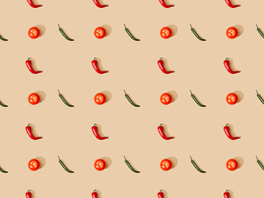 top view of red spicy chili peppers and jalapenos with tomatoes on beige background, seamless pattern