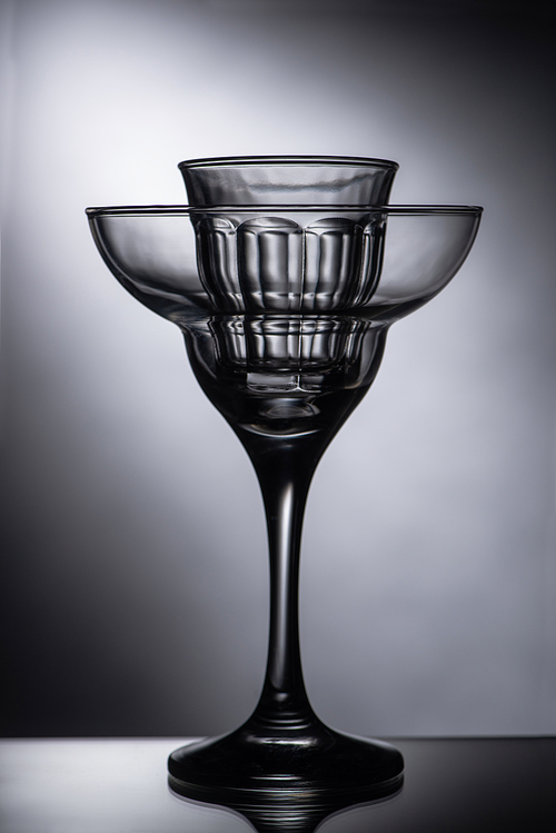 empty shot glass in cocktail glass on dark background