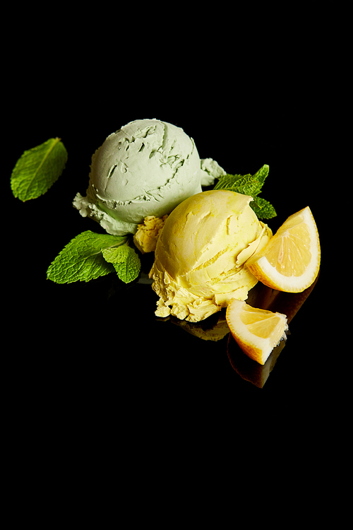 fresh delicious lemon and mint ice cream isolated on black