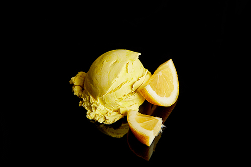 fresh delicious lemon ice cream isolated on black