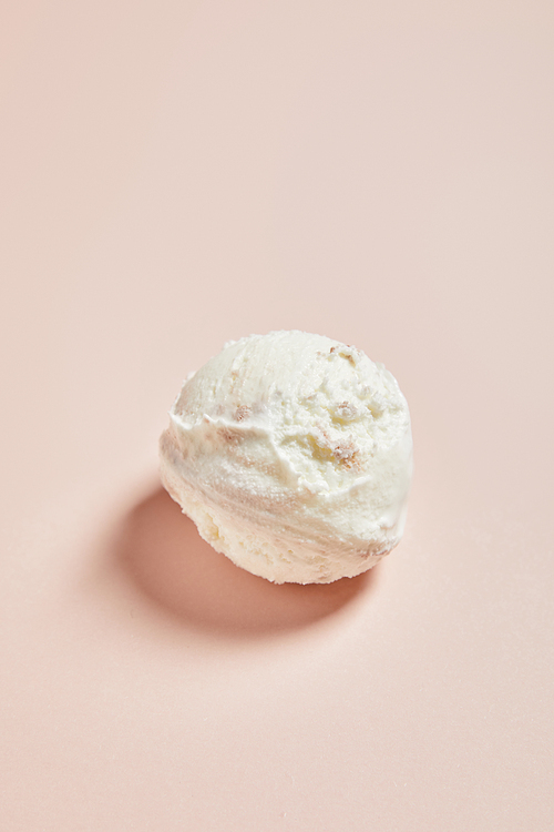 top view of fresh tasty ice cream ball on pink background