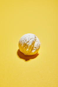 fresh tasty ice cream ball on yellow background