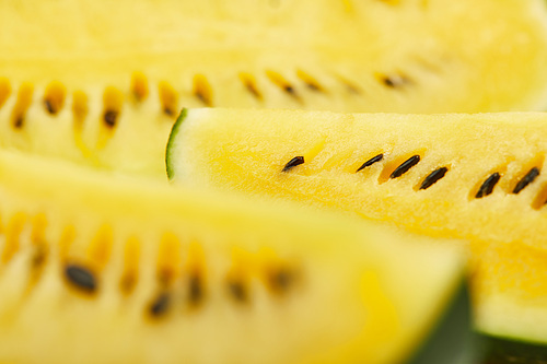 close up view of ripe yellow tasty watermelon with seeds