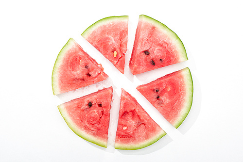 top view of round cut juicy watermelon on white background