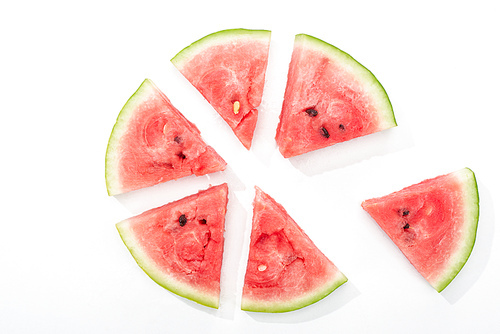 top view of delicious juicy watermelon slices in circle on white background