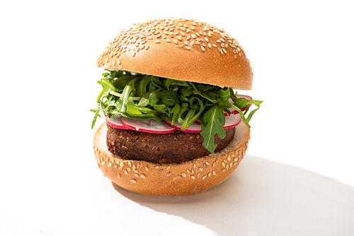 delicious vegan burger with radish and arugula on white background