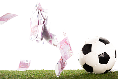 soccer ball near flying euro banknotes isolated on white, sports betting concept