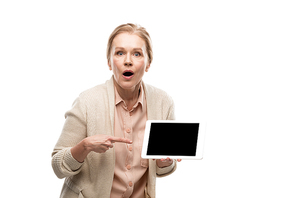 surprised middle aged woman pointing with finger at Digital Tablet with blank screen Isolated On White