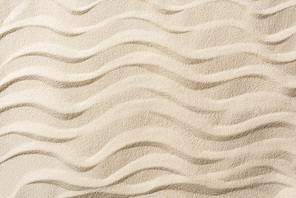 top view of textured background with sand and smooth waves