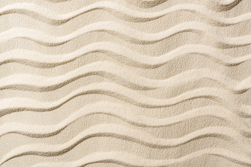top view of textured background with sand and smooth waves