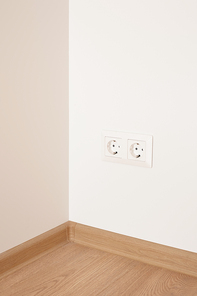 modern power sockets on wall in apartment