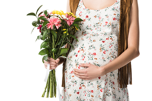cropped view of pregnant woman holding bouquet and touching belly isolated on white