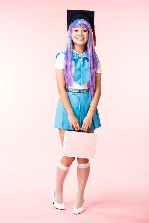 Full length view of smiling anime girl in academic cap holding briefcase on pink