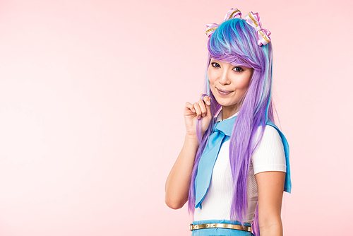 Beautiful asian anime girl in purple wig  isolated on pink