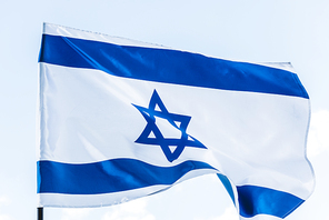 national flag of israel with star of david against sky