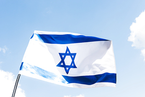 low angle view of national israel flag with blue star of david against sky