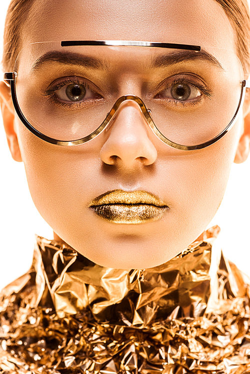 young woman with golden lips in golden foil and sunglasses  isolated on white