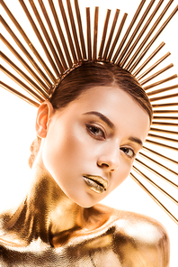 naked young woman painted in golden with accessory on head  isolated on white