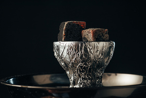 coals on bowl and hookah isolated on black