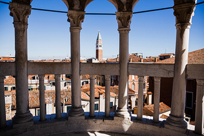 view of ancient buildings and Saint Mark Bell Tower in Venice, Italy