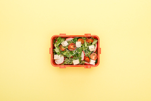 top view of lunch box with salad and vegetables
