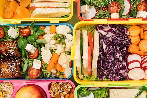 top view of lunch boxes with nutritious food