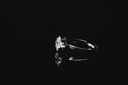 engagement ring with pure diamond isolated on black