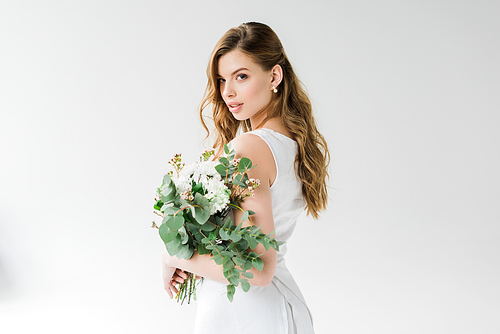 attractive girl in white holding flowers on white