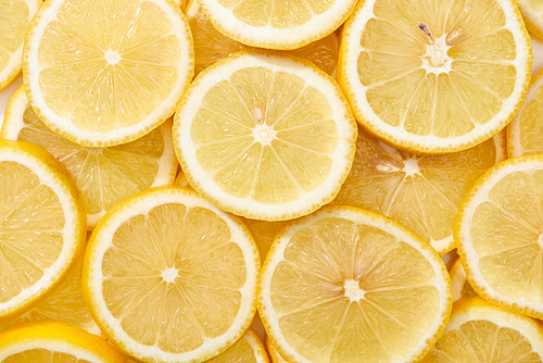 top view of ripe fresh yellow lemon slices