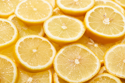 pile of ripe fresh yellow lemon slices