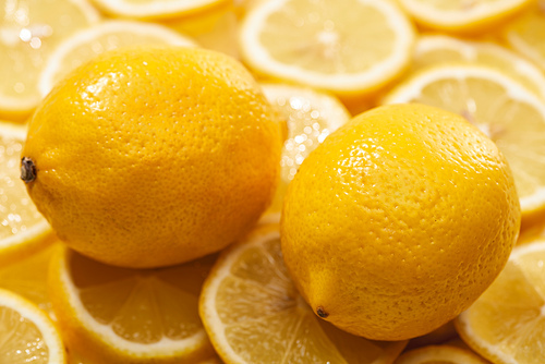 ripe fresh yellow lemons on slices
